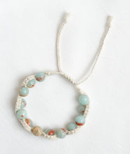 Load image into Gallery viewer, Necklace with light blue beads on a white background