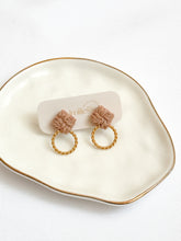 Load image into Gallery viewer, Macrame pair of earrings with gold hoops on a white dish
