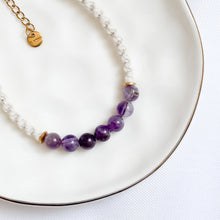 Load image into Gallery viewer, Bracelet with purple beads and gold chain on a white plate