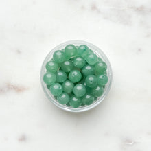 Load image into Gallery viewer, Clear container filler with green beads
