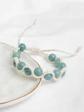 Load image into Gallery viewer, Beaded bracelet on a white plate with a white background

