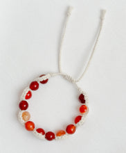 Load image into Gallery viewer, Beaded bracelet with red and orange beads on a white background
