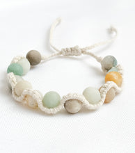 Load image into Gallery viewer, Bracelet with multicolored beads on a white background
