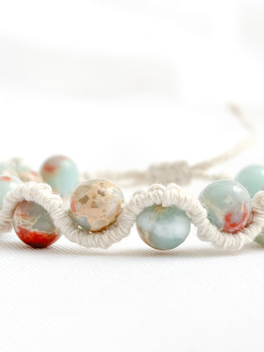 Beaded bracelet with multicolored beads on a white background