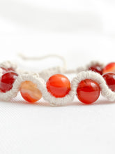 Load image into Gallery viewer, Bracelet with red beads on a white background
