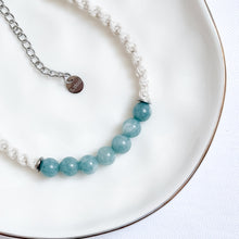 Load image into Gallery viewer, Bracelet with blue beads and silver chain on a white plate
