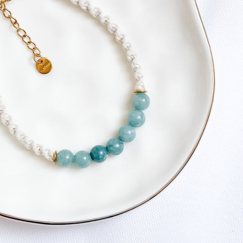 beaed bracelet on a white plate