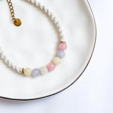 Load image into Gallery viewer, Bracelet with pastel beads on a white plate
